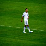 Dimitris Kourbelis wearing Greece kit controlling the ball during an international match