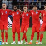 England players during a penalty shootout with Harry Kane preparing to take a penalty