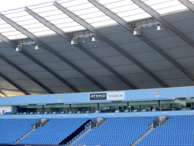 Exterior view of the Etihad Stadium, Manchester City's home ground, showing stands and floodlights